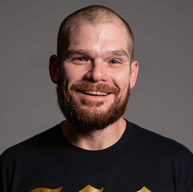 portrait of a smiling man with a beard