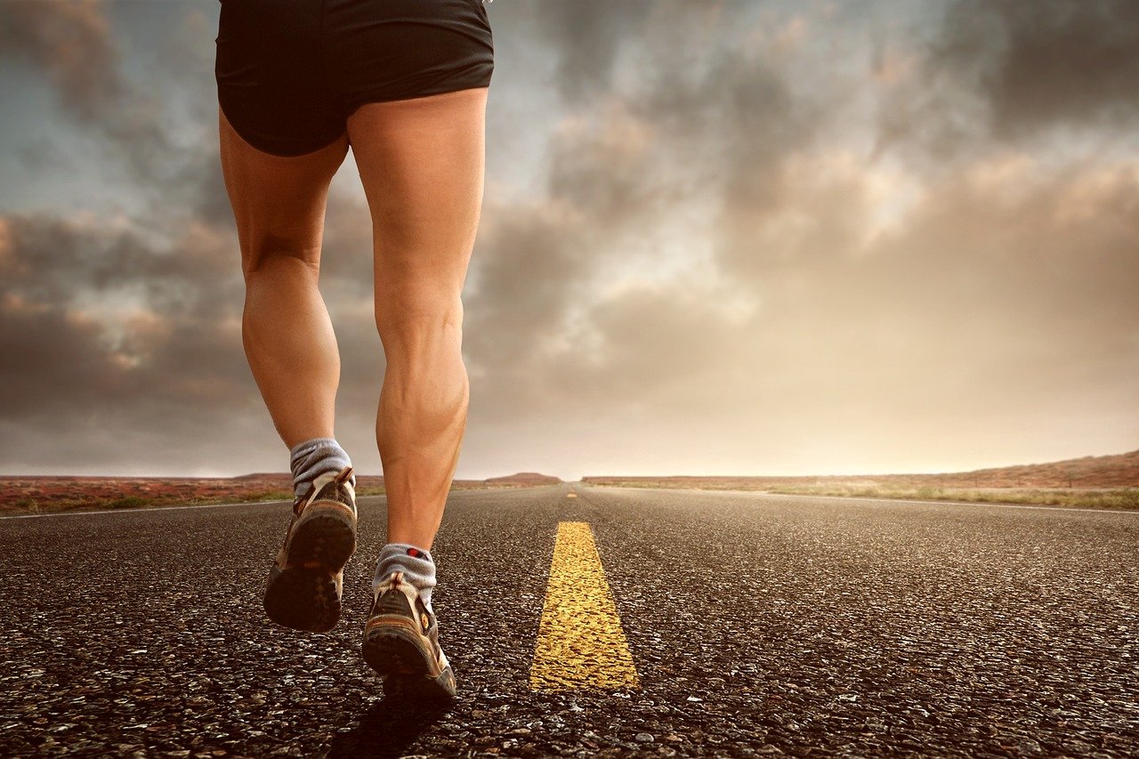 Muscley legs running down a long road ahead